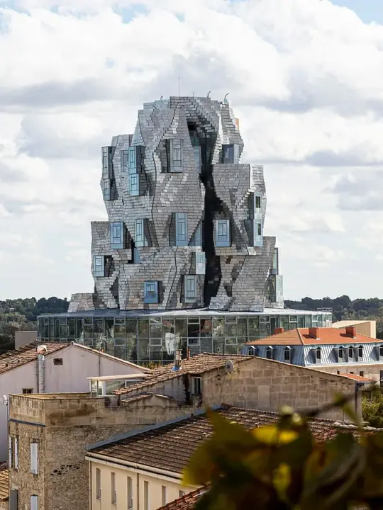 A steel tower above the roofs of Arles